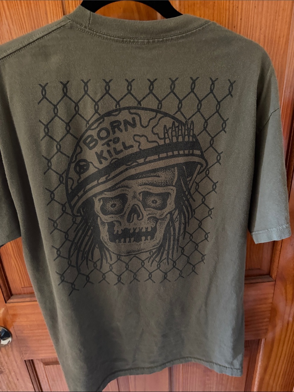 Lurking Class Men’s Olive Green Short-Sleeve Graphic Tee with Skull Helmet Print